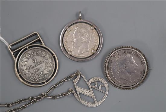 An 800 white metal mounted money clip, a coin set brooch, a coin set pendant, a 925 initial bracelet and a silver bracelet(a.f.).